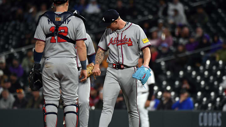 Apr 29, 2025; Denver, Colorado, USA; Atlanta Braves pitcher AJ Smith-Shawver (32) checks his arm after being hit by a line drive during the sixth inning against the Colorado Rockies at Coors Field. Mandatory Credit: Christopher Hanewinckel-Imagn Images