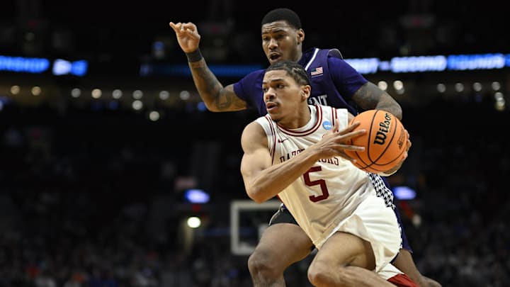 Arkansas guard Darius Acuff Jr. (5) drives against High Point forward Cam'ron Fletcher (11) in the second half during a second round game of the men's 2026 NCAA Tournament at Moda Center. 