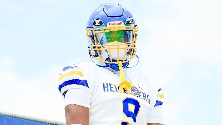 2027 EDGE Day Day McKenzie with his high school gear on for photos