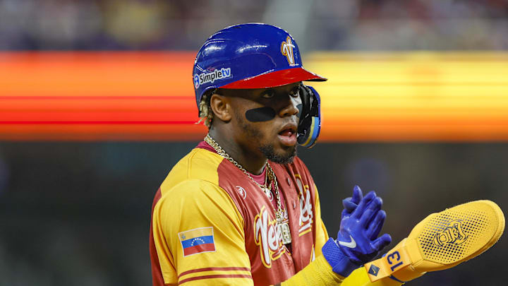 Mar 12, 2023; Miami, Florida, USA; Venezuela center fielder Ronald Acuna Jr. (42) reacts from third base during the first inning against Puerto Rico at LoanDepot Park. Mandatory Credit: Sam Navarro-Imagn Images