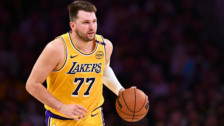 Los Angeles Lakers guard Luka Doncic (77) moves the ball against the Houston Rockets during the first half at Crypto.com Arena.