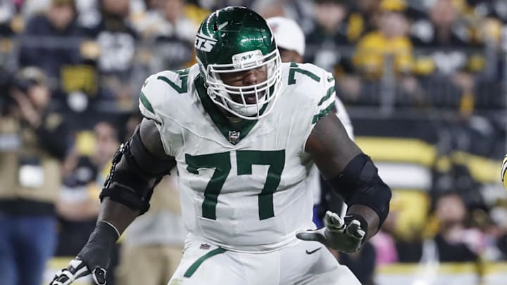 Oct 20, 2024; Pittsburgh, Pennsylvania, USA;  New York Jets offensive tackle Tyron Smith (77) blocks against Pittsburgh Steelers linebacker Alex Highsmith (56) at the line of scrimmage during the third quarter at Acrisure Stadium. Mandatory Credit: Charles LeClaire-Imagn Images