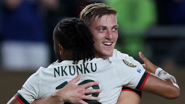 Christopher Nkunku and Liam Delap celebrate the latter's first goal for Chelsea.