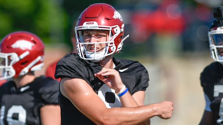 Arkansas Razorbacks backup quarterback Grayson Wilson following through after a pass in preseason practices on the outdoor fields in Fayetteville, Ark. Arkansas Razorbacks backup quarterback Grayson Wilson following through after a pass in preseason practices on the outdoor fields in Fayetteville, Ark.