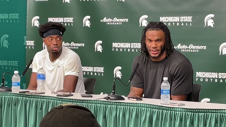 Michigan State's Aidan Chiles (left) and Jordan Hall (right) talk to the media after a 42-40 win over Boston College.