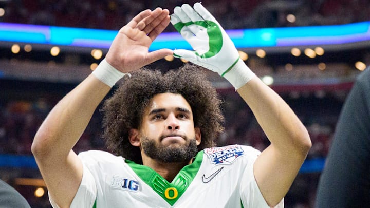 Oregon quarterback Dante Moore walks off the field as the Oregon Ducks face the Indiana Hoosiers in the Peach Bowl on Jan. 9, 2026, at Mercedes-Benz Stadium in Atlanta, Georgia.