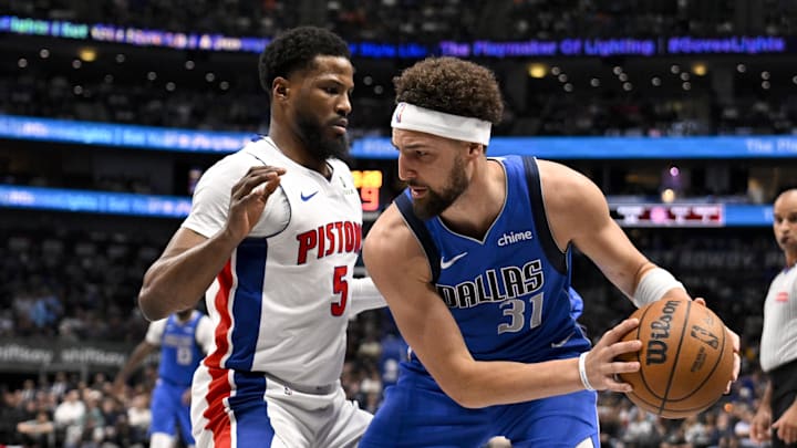 Mar 21, 2025; Dallas, Texas, USA; Dallas Mavericks guard Klay Thompson (31) looks to move the ball past Detroit Pistons guard Malik Beasley (5) during the first half at the American Airlines Center. Mandatory Credit: Jerome Miron-Imagn Images