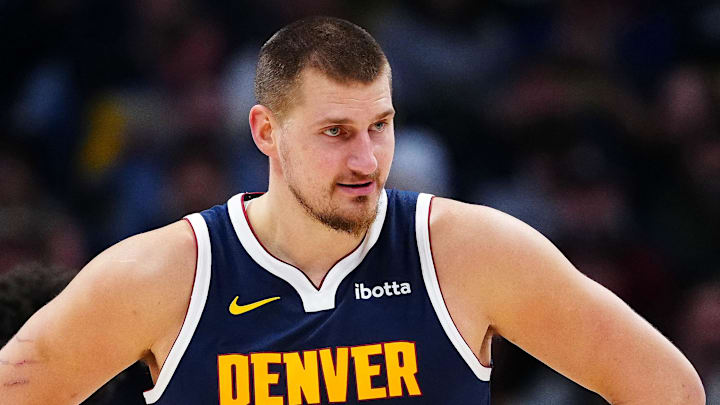 Dec 15, 2025; Denver, Colorado, USA; Denver Nuggets center Nikola Jokic (15) reacts in the second quarter against the Houston Rockets at Ball Arena. Mandatory Credit: Ron Chenoy-Imagn Images