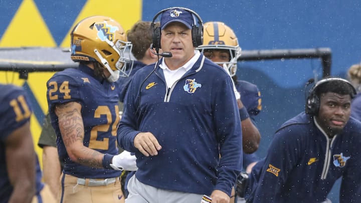 Sep 27, 2025; Morgantown, West Virginia, USA; West Virginia Mountaineers head coach Rich Rodriguez watches a play during the first quarter against the Utah Utes at Milan Puskar Stadium. Mandatory Credit: Ben Queen-Imagn Images