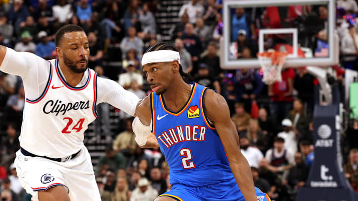 Mar 23, 2025; Inglewood, California, USA; Oklahoma City Thunder guard Shai Gilgeous-Alexander (2) drives against LA Clippers guard Norman Powell (24) during the 4th quarter at Intuit Dome. Mandatory Credit: Jason Parkhurst-Imagn Images Mar 23, 2025; Inglewood, California, USA; Oklahoma City Thunder guard Shai Gilgeous-Alexander (2) drives against LA Clippers guard Norman Powell (24) during the 4th quarter at Intuit Dome. Mandatory Credit: Jason Parkhurst-Imagn Images