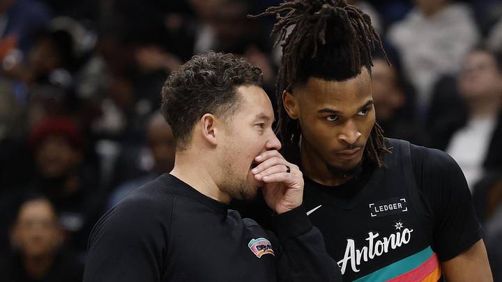 Dec 21, 2025; Washington, District of Columbia, USA; San Antonio Spurs head coach Mitch Johnson (L)) talks with Spurs guard Stephon Castle (5) during a timeout against the Washington Wizards in the second half at Capital One Arena. Mandatory Credit: Geoff Burke-Imagn Images