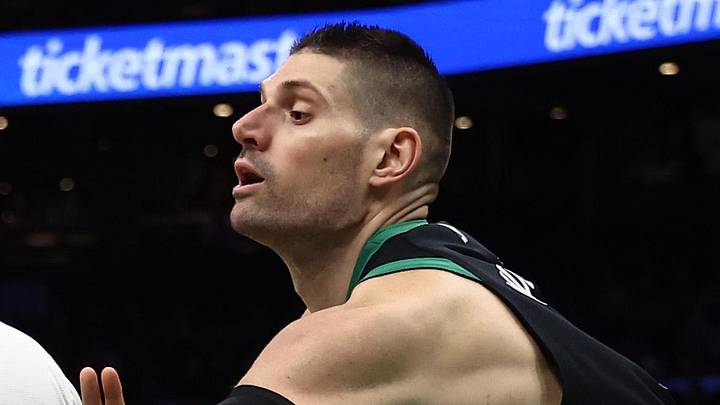 Apr 10, 2026; Boston, Massachusetts, USA; Boston Celtics center Nikola Vucevic (4) tries to knock the ball away from New Orleans Pelicans center Derik Queen (22) during the second half at TD Garden. Mandatory Credit: Winslow Townson-Imagn Images