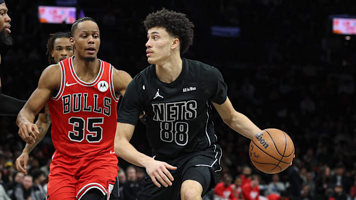 Feb 9, 2026; Brooklyn, New York, USA; Brooklyn Nets guard Nolan Traore (88) is guarded by Chicago Bulls forward Isaac Okoro (35) and forward Guerschon Yabusele (28) during the second half at Barclays Center. Mandatory Credit: Vincent Carchietta-Imagn Images