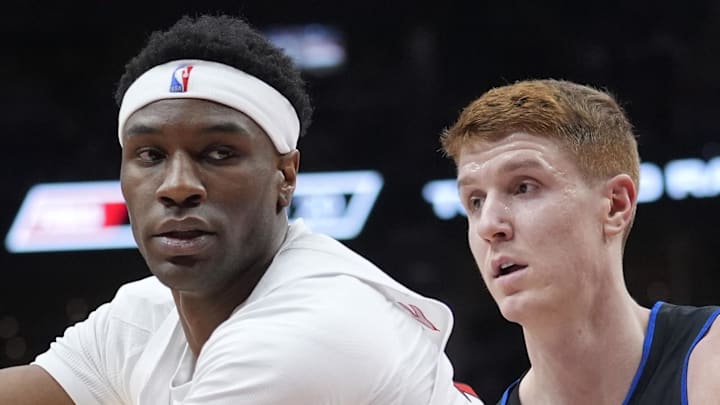 Toronto Raptors guard Ja'Kobe Walter controls the ball against Detroit Pistons guard Kevin Huerter.