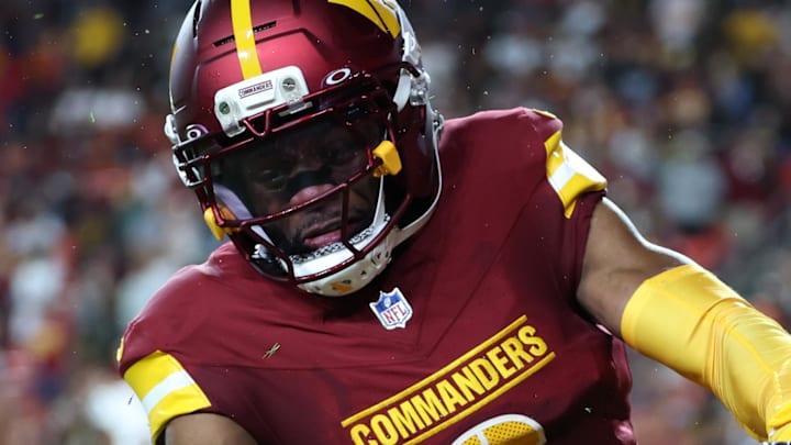 Cincinnati Bengals wide receiver Charlie Jones scores a touchdown past Washington Commanders cornerback Noah Igbinoghene. Cincinnati Bengals wide receiver Charlie Jones scores a touchdown past Washington Commanders cornerback Noah Igbinoghene.