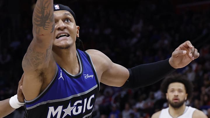 Apr 29, 2026; Detroit, Michigan, USA; Detroit Pistons guard Ausar Thompson (9) and Orlando Magic forward Paolo Banchero (5) goes for the rebound in the second half during game five of the first round of the 2026 NBA Playoffs at Little Caesars Arena. Mandatory Credit: Rick Osentoski-Imagn Images