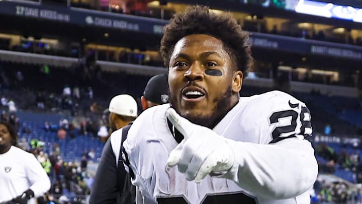 Las Vegas Raiders running back Josh Jacobs (28) celebrates after leading the way to an astounding win at Seattle in 2022. Las Vegas Raiders running back Josh Jacobs (28) celebrates after leading the way to an astounding win at Seattle in 2022.