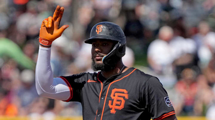 Mar 15, 2025; Scottsdale, Arizona, USA; San Francisco Giants outfielder Jerar Encarnacion (59) reacts after hitting a double against the Seattle Mariners in the second inning at Scottsdale Stadium.
