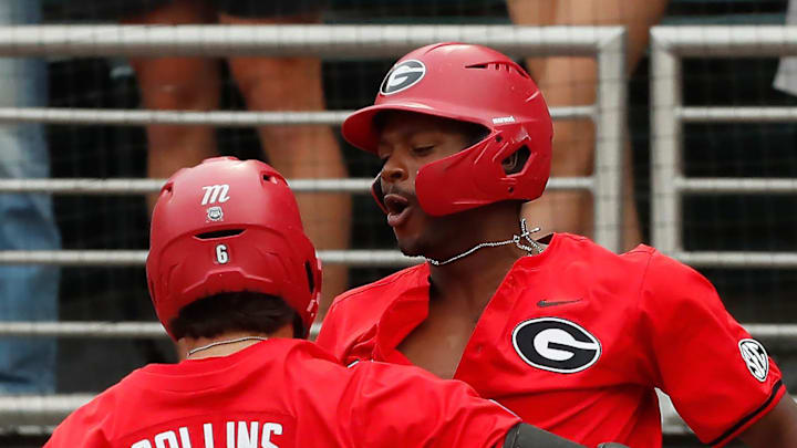 Georgia's Corey Collins (6) celebrates with his teammates after hitting a home run during a NCAA Athens Regional baseball game against UNCW in Athens, Ga., on Saturday, June 1, 2024.