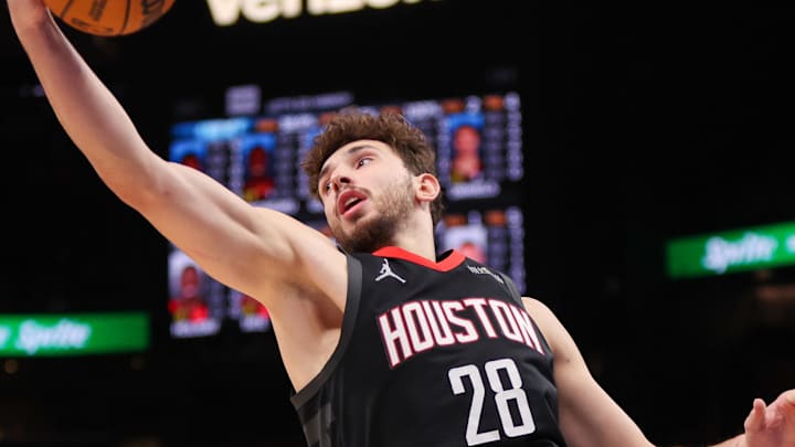 Jan 28, 2025; Atlanta, Georgia, USA; Houston Rockets center Alperen Sengun (28) grabs a rebound against the Atlanta Hawks in the second quarter at State Farm Arena. Mandatory Credit: Brett Davis-Imagn Images