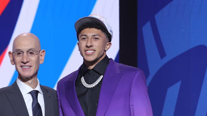 Jun 25, 2025; Brooklyn, NY, USA; Nique Clifford stands with NBA commissioner Adam Silver after being selected as the 24th pick by the Oklahoma City Thunder in the first round of the 2025 NBA Draft at Barclays Center. Mandatory Credit: Brad Penner-Imagn Images Jun 25, 2025; Brooklyn, NY, USA; Nique Clifford stands with NBA commissioner Adam Silver after being selected as the 24th pick by the Oklahoma City Thunder in the first round of the 2025 NBA Draft at Barclays Center. Mandatory Credit: Brad Penner-Imagn Images