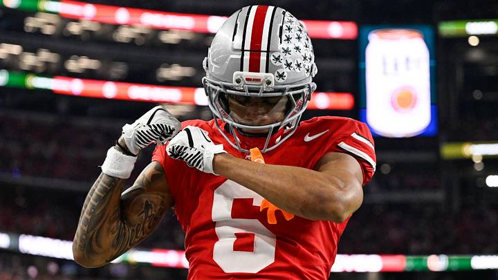 Ohio State Buckeyes cornerback Devin Sanchez (6) celebrates in the second quarter against the Miami Hurricanes during the 2025 Cotton Bowl and quarterfinal game of the College Football Playoff at AT&T Stadium. Ohio State Buckeyes cornerback Devin Sanchez (6) celebrates in the second quarter against the Miami Hurricanes during the 2025 Cotton Bowl and quarterfinal game of the College Football Playoff at AT&T Stadium.