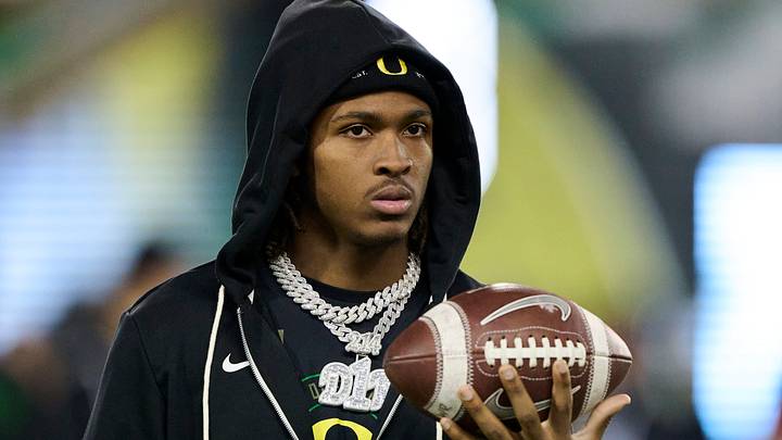 Nov 14, 2025; Eugene, Oregon, USA; Oregon Ducks wide receiver Dakorien Moore (1) watches teammates warm up before a game against the Minnesota Golden Gophers at Autzen Stadium. Mandatory Credit: Troy Wayrynen-Imagn Images Nov 14, 2025; Eugene, Oregon, USA; Oregon Ducks wide receiver Dakorien Moore (1) watches teammates warm up before a game against the Minnesota Golden Gophers at Autzen Stadium. Mandatory Credit: Troy Wayrynen-Imagn Images