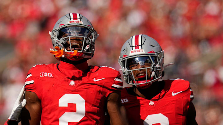 Ohio State Buckeyes safety Caleb Downs (2) celebrates an interception with cornerback Jermaine Mathews Jr. (7) abnd linebacker Sonny Styles (0) during the first half of the NCAA football game against the Grambling State Tigers at Ohio Stadium on Sept. 6, 2025.