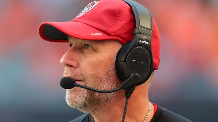 Nov 15, 2025; Miami Gardens, Florida, USA; NC State Wolfpack head coach Dave Doeren watches from the sideline against the Miami Hurricanes during the second quarter at Hard Rock Stadium. Mandatory Credit: Sam Navarro-Imagn Images