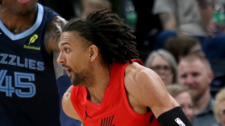 Portland Trail Blazers guard Matisse Thybulle dribbles as Memphis Grizzlies forward GG Jackson defends.