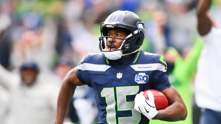 Sep 21, 2025; Seattle, Washington, USA; Seattle Seahawks wide receiver Tory Horton (15) makes a 95 yard punt return for a touchdown during the first quarter against the New Orleans Saints at Lumen Field. Mandatory Credit: Steven Bisig-Imagn Images
