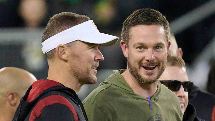 Nov 11, 2023; Eugene, Oregon, USA; USC Trojans head coach Lincoln Riley, left, and Oregon Ducks head coach Dan Lanning talk before a game at Autzen Stadium. Nov 11, 2023; Eugene, Oregon, USA; USC Trojans head coach Lincoln Riley, left, and Oregon Ducks head coach Dan Lanning talk before a game at Autzen Stadium.