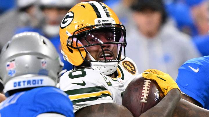 Green Bay Packers running back Josh Jacobs (8) runs the ball against the Detroit Lions last season. Green Bay Packers running back Josh Jacobs (8) runs the ball against the Detroit Lions last season.