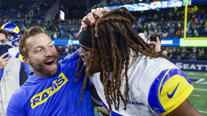 Nov 3, 2024; Seattle, Washington, USA; Los Angeles Rams wide receiver Demarcus Robinson (15) celebrates with head coach Sean McVay, left, after catching a game-wining touchdown pass against the Seattle Seahawks during overtime at Lumen Field. Mandatory Credit: Joe Nicholson-Imagn Images