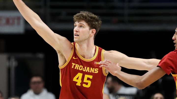 Feb 8, 2026; University Park, Pennsylvania, USA; Southern California Trojans center Gabe Dynes (45) defends as Penn State Nittany Lions guard Freddie Dilione V (5) holds the ball during the second half at Bryce Jordan Center. Mandatory Credit: Matthew O'Haren-Imagn Images