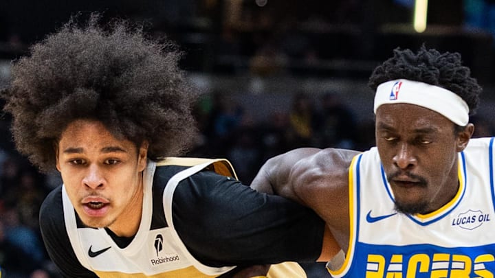 Indiana Pacers forward Pascal Siakam dribbles the ball while Washington Wizards forward Kyshawn George defends Indiana Pacers forward Pascal Siakam dribbles the ball while Washington Wizards forward Kyshawn George defends