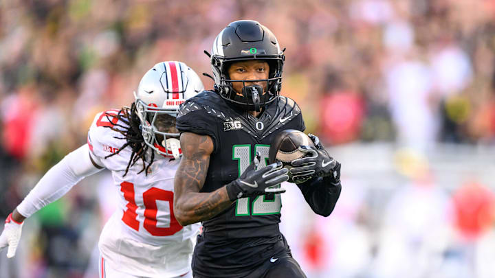 Oct 12, 2024; Eugene, Oregon, USA; Oregon Ducks wide receiver Tez Johnson (15) makes a catch for a touchdown during the second quarter against the Ohio State Buckeyes at Autzen Stadium. 