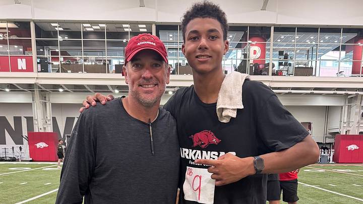 Boerne Champion (Texas) High School quarterback Ryder Flugence with Arkansas QB coach Mitch Stewart during Razorbacks football camp. Boerne Champion (Texas) High School quarterback Ryder Flugence with Arkansas QB coach Mitch Stewart during Razorbacks football camp.