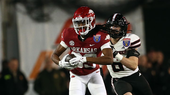 Dec 27, 2024; Memphis, TN, USA; Arkansas Razorbacks wide receiver Dazmin James (83) runs after a catch during the second quarter against the Texas Tech Red Raiders at Simmons Bank Liberty Stadium. Mandatory Credit: Petre Thomas-Imagn Images