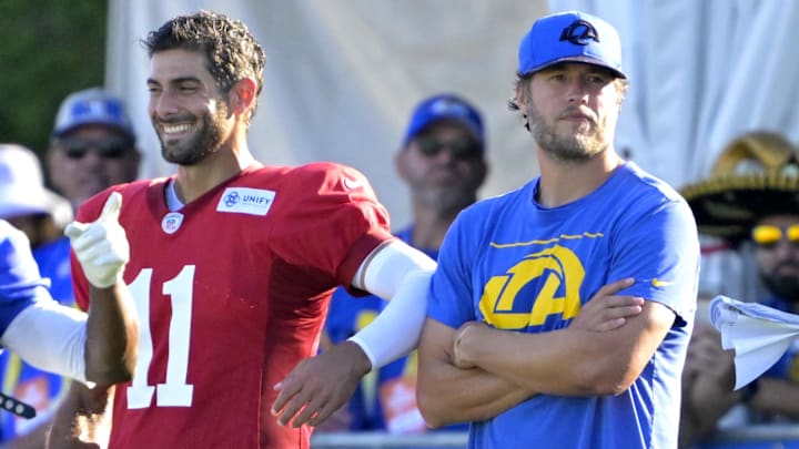 Jul 29, 2024; Los Angeles, CA, USA; Los Angeles Rams quarterback Jimmy Garoppolo (11), quarterback Matthew Stafford (9) and quarterbacks coach Dave Ragone talks during training camp at Loyola Marymount University. Mandatory Credit: Jayne Kamin-Oncea-Imagn Images Jul 29, 2024; Los Angeles, CA, USA; Los Angeles Rams quarterback Jimmy Garoppolo (11), quarterback Matthew Stafford (9) and quarterbacks coach Dave Ragone talks during training camp at Loyola Marymount University. Mandatory Credit: Jayne Kamin-Oncea-Imagn Images