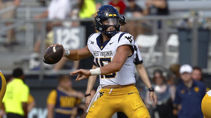 Oct 18, 2025; Orlando, Florida, USA;  West Virginia Mountaineers quarterback Scotty Fox Jr. (15) makes a second half pass against the Central Florida Knights at Acrisure Bounce House. Mandatory Credit: Russell Lansford-Imagn Images