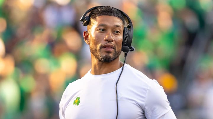 Oct 4, 2025; South Bend, Indiana, USA; Notre Dame head football coach Marcus Freeman adjusts his radio against the Boise State Broncos at Notre Dame Stadium. Mandatory Credit: Michael Caterina-Imagn Images Oct 4, 2025; South Bend, Indiana, USA; Notre Dame head football coach Marcus Freeman adjusts his radio against the Boise State Broncos at Notre Dame Stadium. Mandatory Credit: Michael Caterina-Imagn Images
