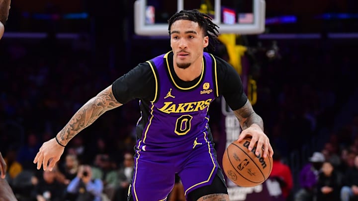 Los Angeles Lakers guard Jalen Hood-Schifino (0) drives against the Phoenix Suns at Crypto.com Arena. Los Angeles Lakers guard Jalen Hood-Schifino (0) drives against the Phoenix Suns at Crypto.com Arena.