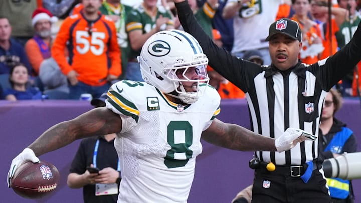  Green Bay Packers running back Josh Jacobs (8) reacts after a touchdown against the Denver Broncos.