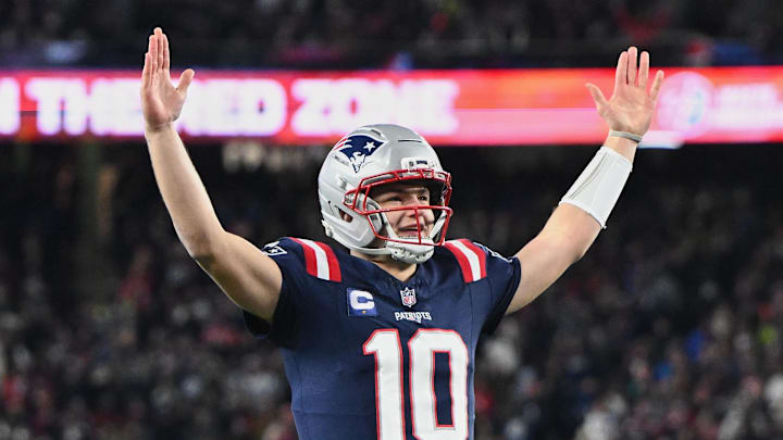 Jan 4, 2026; Foxborough, Massachusetts, USA; New England Patriots quarterback Drake Maye (10) reacts to a Patriots touchdown scored against the Miami Dolphins during the first quarter at Gillette Stadium. Mandatory Credit: Brian Fluharty-Imagn Images