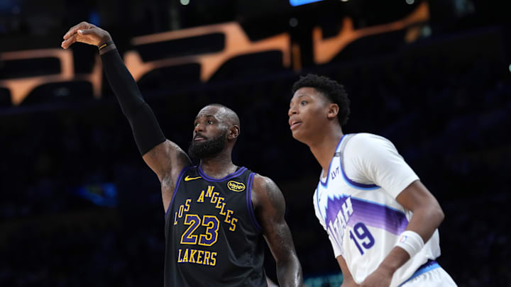Nov 18, 2025; Los Angeles, California, USA; Los Angeles Lakers forward LeBron James (23) follows through on a three-point shot against Utah Jazz guard Ace Bailey (19) in the second quarter at Crypto.com Arena. Mandatory Credit: Kirby Lee-Imagn Images Nov 18, 2025; Los Angeles, California, USA; Los Angeles Lakers forward LeBron James (23) follows through on a three-point shot against Utah Jazz guard Ace Bailey (19) in the second quarter at Crypto.com Arena. Mandatory Credit: Kirby Lee-Imagn Images