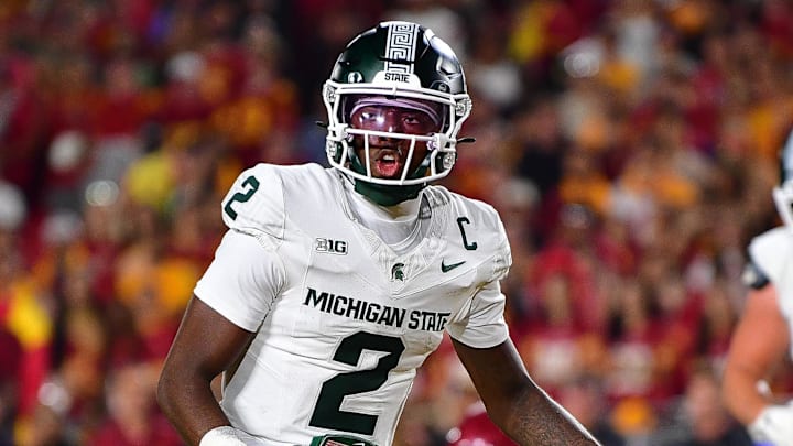 Sep 20, 2025; Los Angeles, California, USA; Michigan State Spartans quarterback Aidan Chiles (2) scores a touchdown against the Southern California Trojans during the second half at the Los Angeles Memorial Coliseum. Mandatory Credit: Gary A. Vasquez-Imagn Images