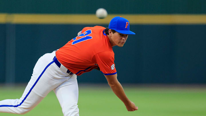 Florida utility Caden McDonald (21) warms up during the fifth inning of an NCAA college baseball matchup Tuesday, March 25, 2025 at VyStar Ballpark in Jacksonville, Fla. FSU rallied to defeat UF 8-4 off a walk-off grand slam from Alex Lodise in the ninth inning.