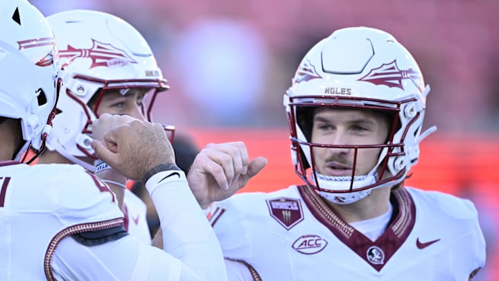 Sep 28, 2024; Dallas, Texas, USA; Florida State Seminoles quarterback DJ Uiagalelei (4) and quarterback Luke Kromenhoek (14) and quarterback Brock Glenn (11) before the game between the Southern Methodist Mustangs and the Florida State Seminoles at Gerald J. Ford Stadium. Mandatory Credit: Jerome Miron-Imagn Images Sep 28, 2024; Dallas, Texas, USA; Florida State Seminoles quarterback DJ Uiagalelei (4) and quarterback Luke Kromenhoek (14) and quarterback Brock Glenn (11) before the game between the Southern Methodist Mustangs and the Florida State Seminoles at Gerald J. Ford Stadium. Mandatory Credit: Jerome Miron-Imagn Images