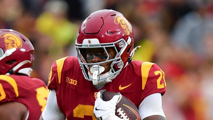 Nov 15, 2025; Los Angeles, California, USA; Southern California Trojans running back Bryan Jackson (21) runs the ball against the Iowa Hawkeyes during the second half at the Los Angeles Memorial Coliseum. Mandatory Credit: Gary A. Vasquez-Imagn Images